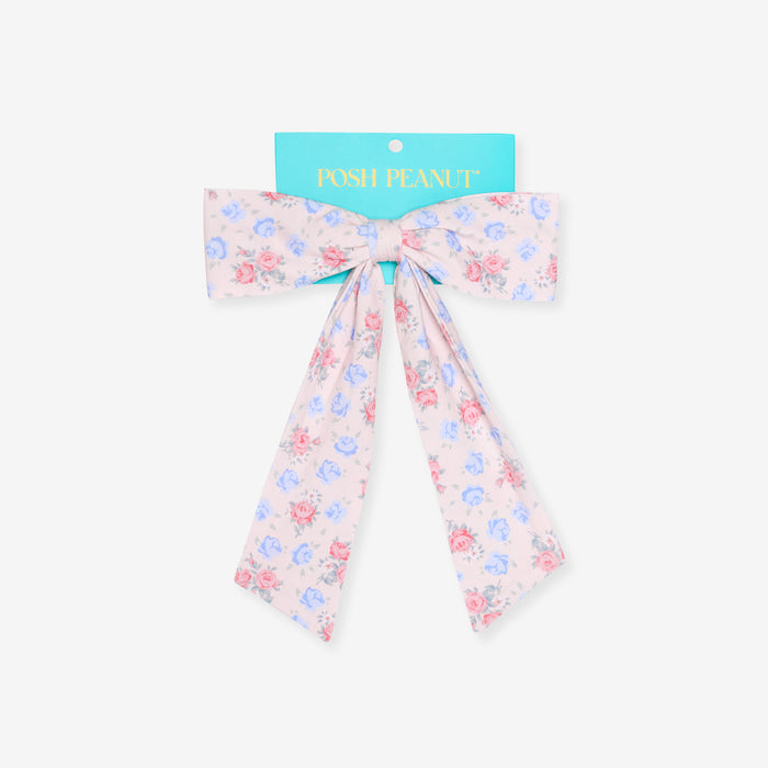 Floral bow with 'Posh Peanut' packaging on a white background