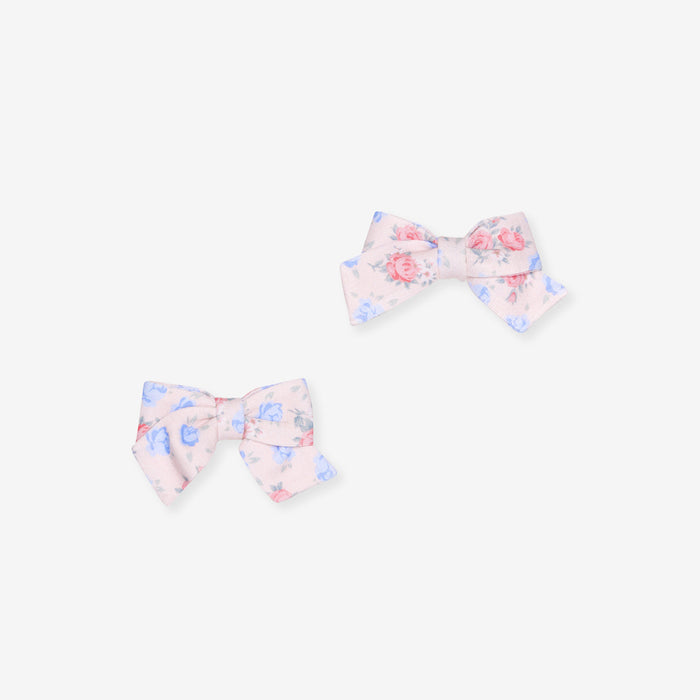 Two floral hair bows on a white background