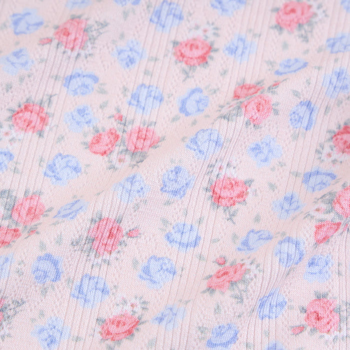 Floral pattern with pink and blue flowers on a light background