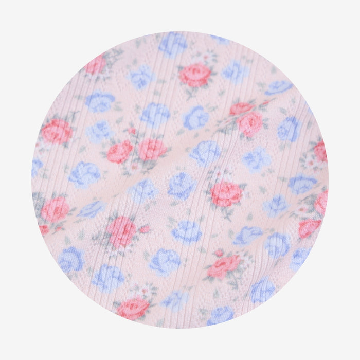 Floral patterned fabric swatch on a white background