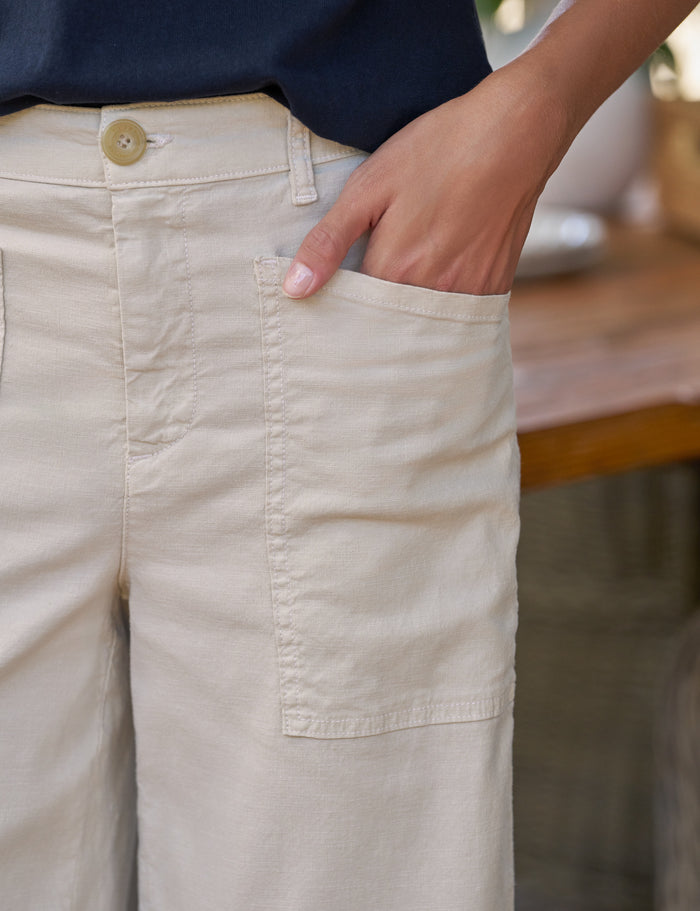 Close-up of beige pants with a blurred background