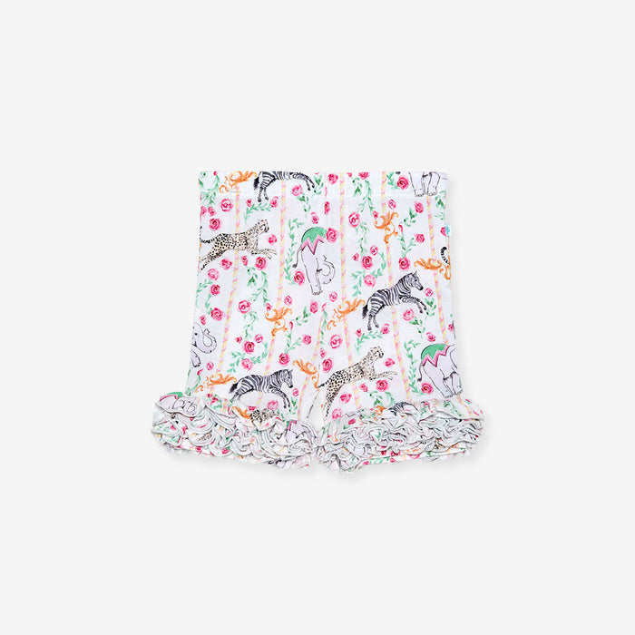 Floral and animal print baby shorts on a white background