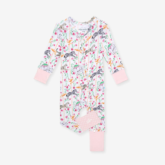 Floral and animal patterned baby onesie with pink accents on a white background
