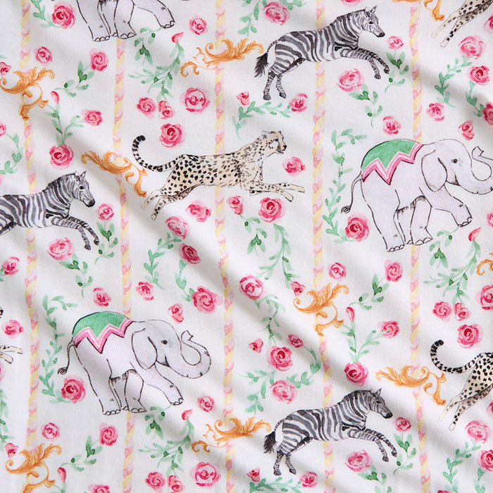 Fabric with animal and floral pattern on a white background
