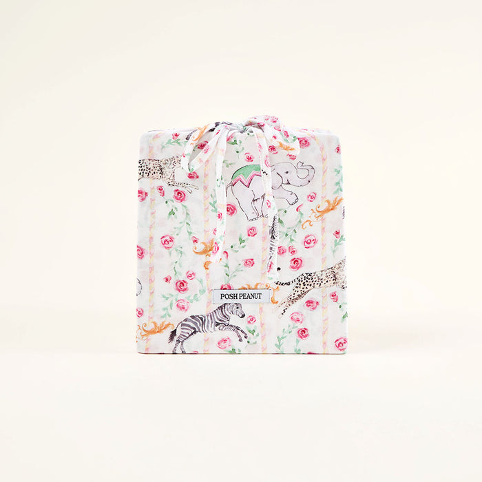 Floral and animal patterned blanket with 'Posh Peanut' branding on a white background