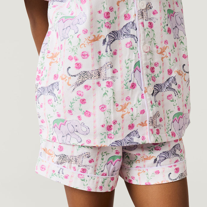 Pajama set with animal and floral pattern on a plain background