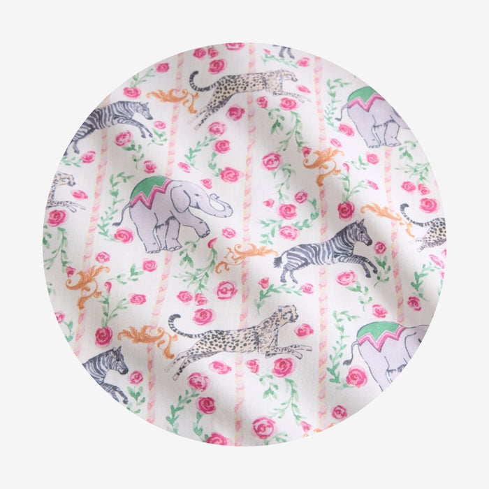 Fabric swatch with animal and floral pattern on a white background