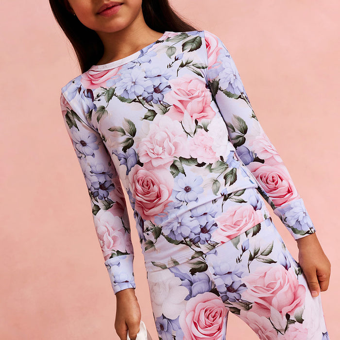 Floral dress with pink and purple flowers on a pink background