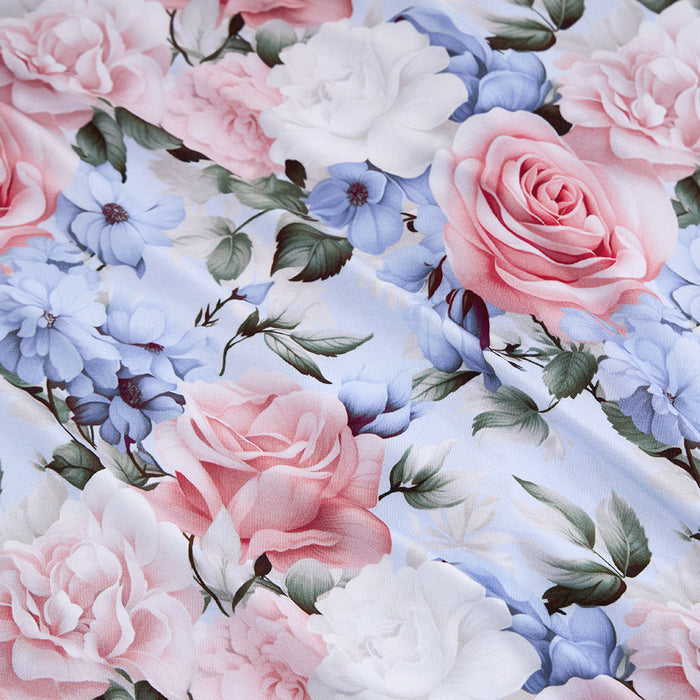 Floral pattern with pink, blue, and white flowers on a white background