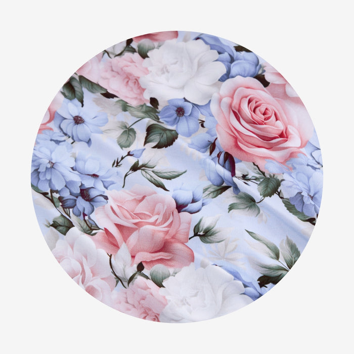Floral pattern with pink and blue flowers on a white background
