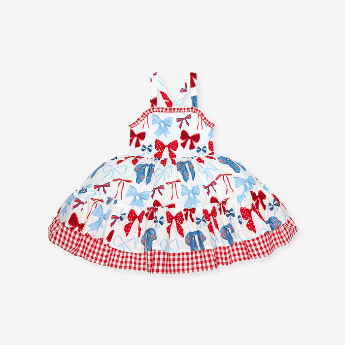 Children's dress with bow pattern on a white background