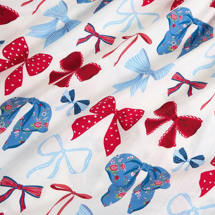 Pattern of red and blue bows on a white background