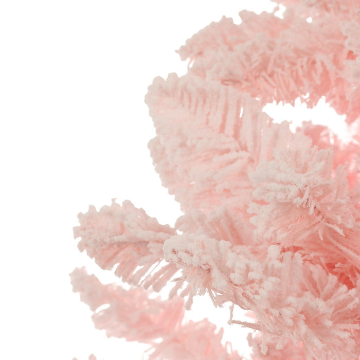 Close-up of a pink artificial Christmas tree branch on a white background