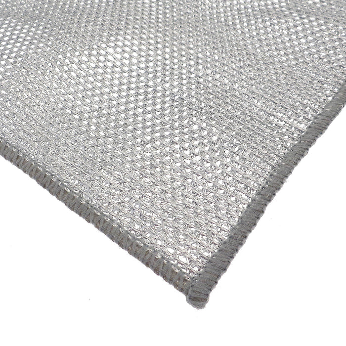 Close-up of a textured silver open weave cleaning cloth on a white background