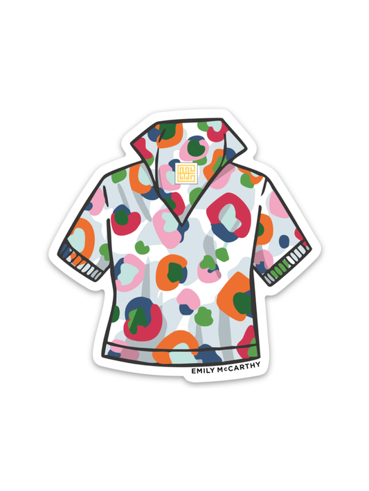 The Poppy Top Sticker is a vibrant, multicolored short-sleeve collared shirt with an abstract pattern and Emily McCarthy tags, finished with a custom 3-inch sticker for extra flair.