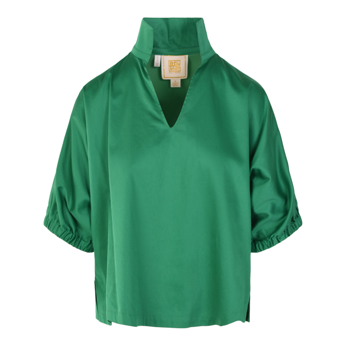 The Poppy Top is a green cotton poplin blouse with a loose fit, short sleeves gathered at the hem, a high collar and V-neckline. A beige label is visible inside the collar.