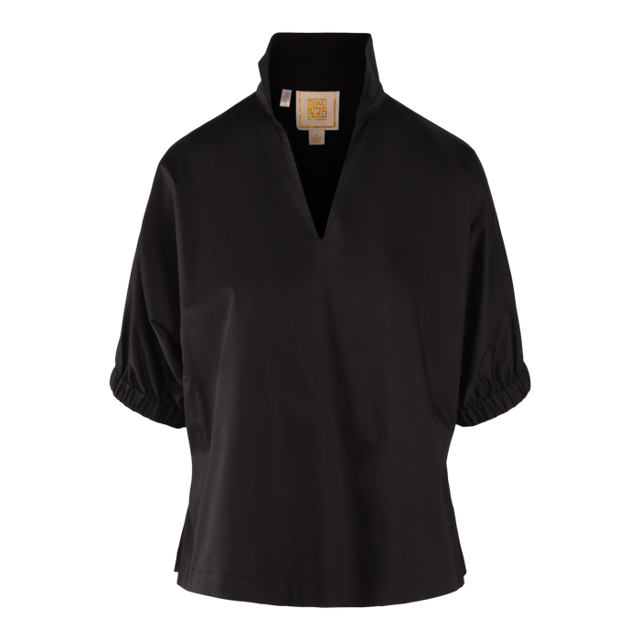 The Poppy Top is a black short-sleeve blouse made from soft Black Ponte, featuring a high split neckline, gathered elastic cuffs, and a relaxed fit. It is shown against a plain white background.