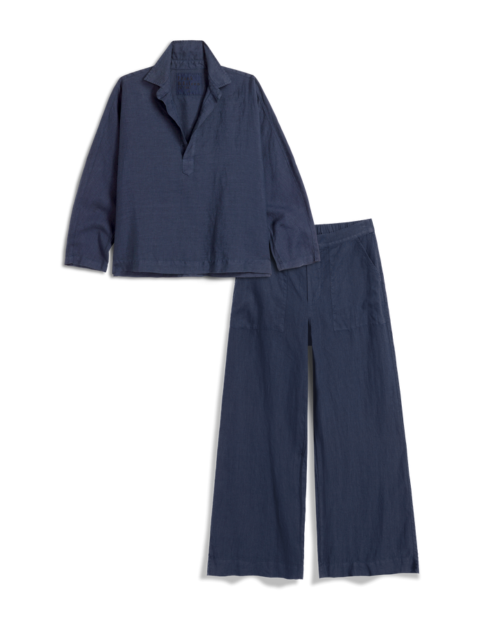 Navy blue shirt and pants set on a white background