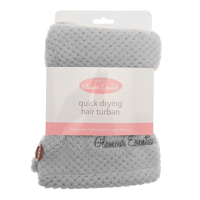 Grey colour quick drying hair turbie with packaging sleeve and hanger on a white background