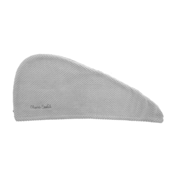 Grey hair drying turban with waffle texture laid flat on a white background