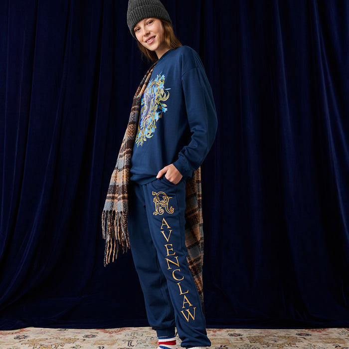 Person wearing Harry Potter Ravenclaw jogger set in navy with crest graphic