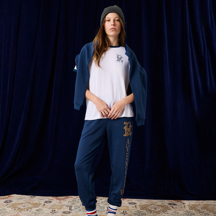 Person wearing Harry Potter Ravenclaw jogger pants with printed text