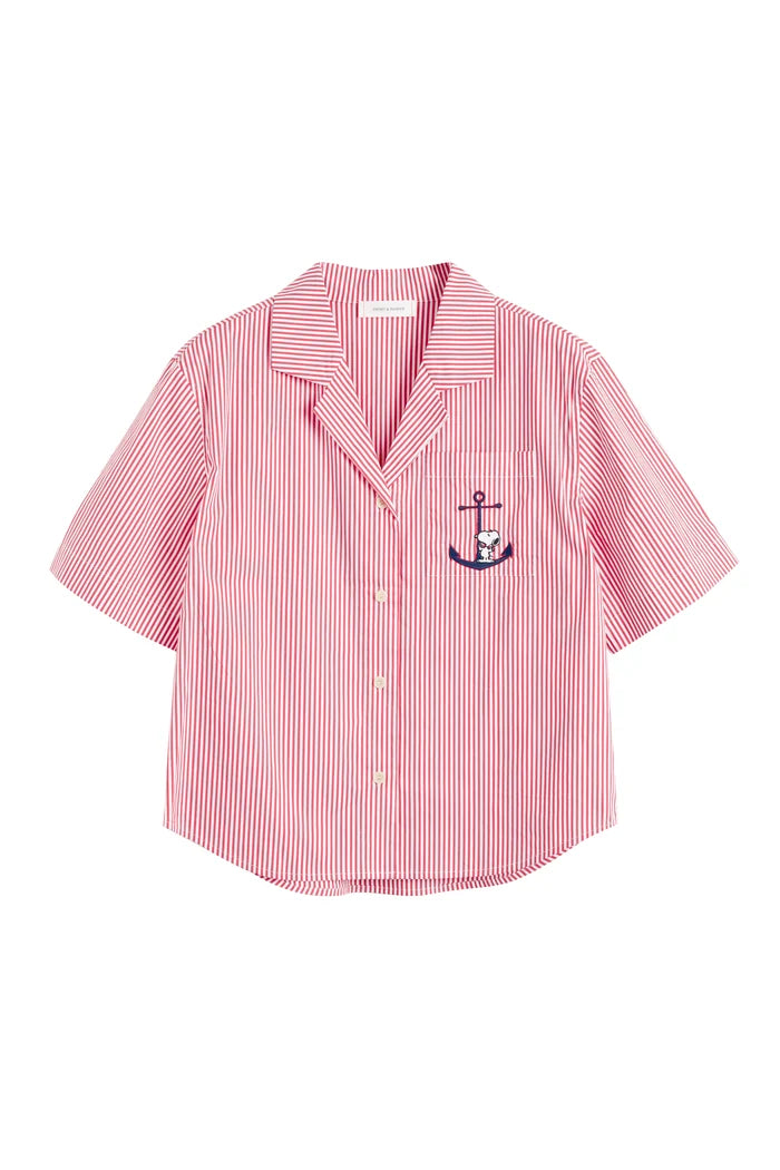 Pink striped shirt with anchor emblem on a white background
