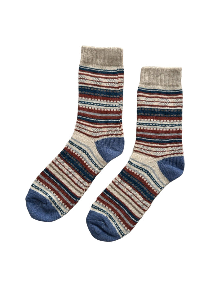 Sierra Loom socks close-up showing wool-blend knit texture in mountain blue and red tones
