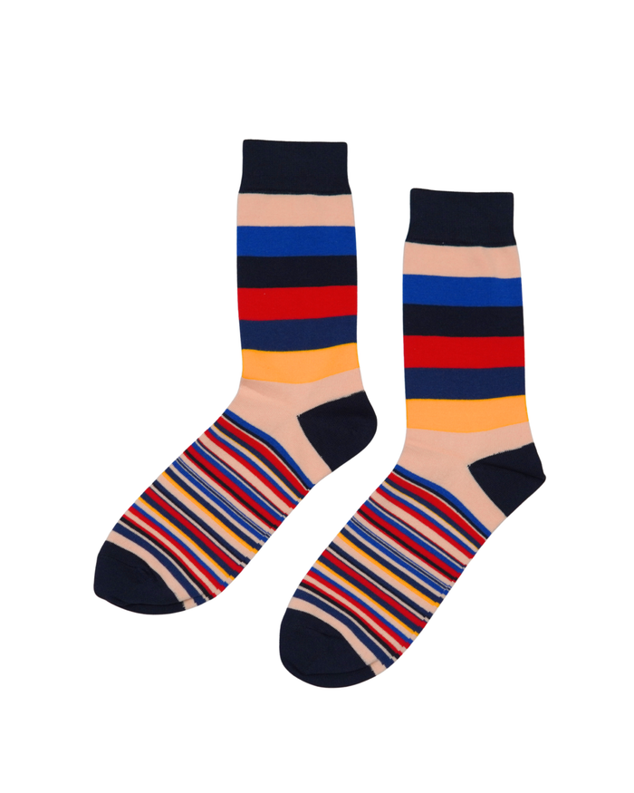 Varsity Block crew socks flat lay showing bold navy, peach, blue, red, and gold block stripe pattern
