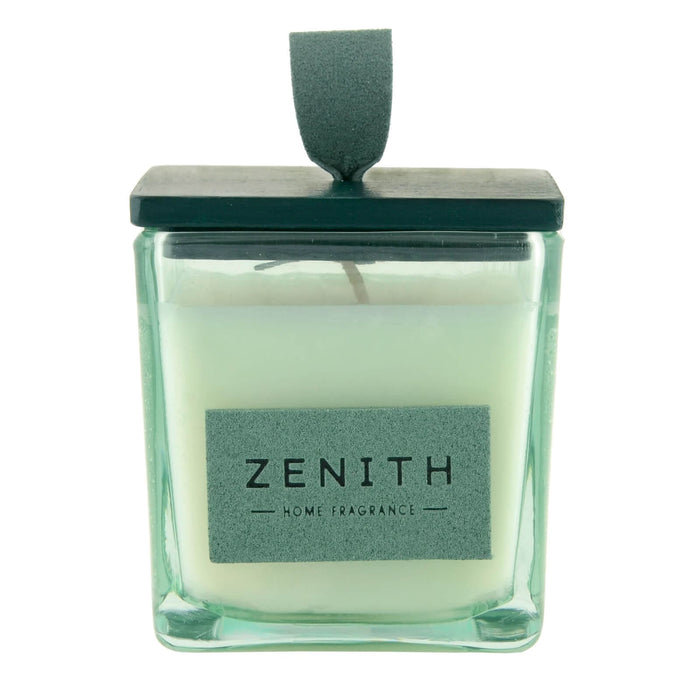 Candle in a glass container with a green lid and 'Zenith' label on a white background